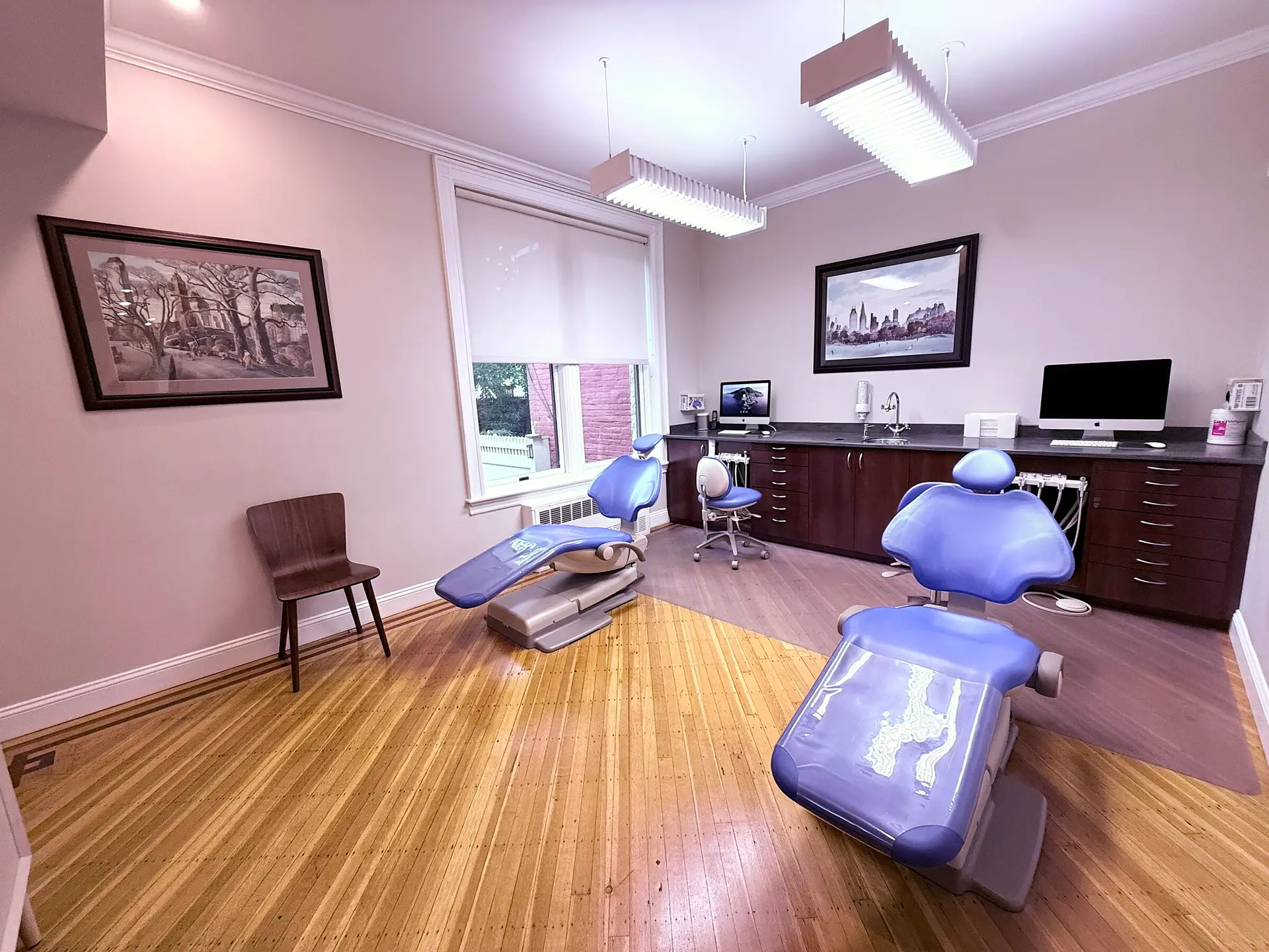 Bright treatment room with two orthodontic chairs at Costalos Orthodontics in Bay Ridge, Brooklyn